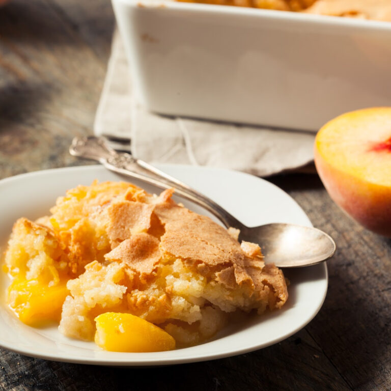Peach cobbler on a white plate