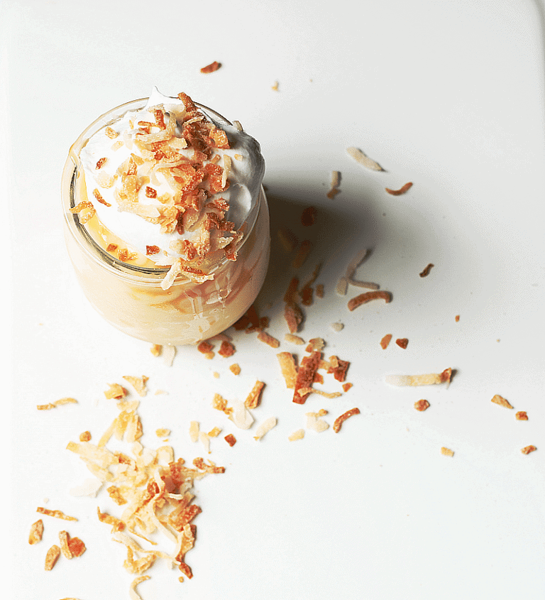 Fresh toasted coconut served atop whipped cream, caramel sauce and tapioca pudding ~ cupcakesandcrinoline.com
