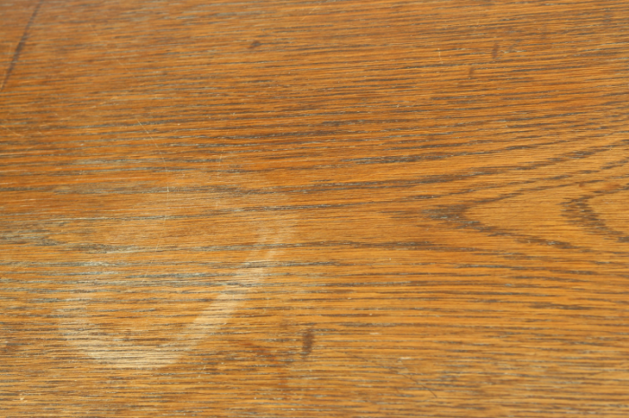 Antique oak dresser with a white mark left from a water stain - before