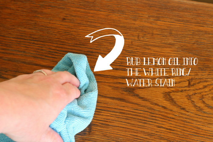 Rubbing Lemon Oil into a water mark on wood