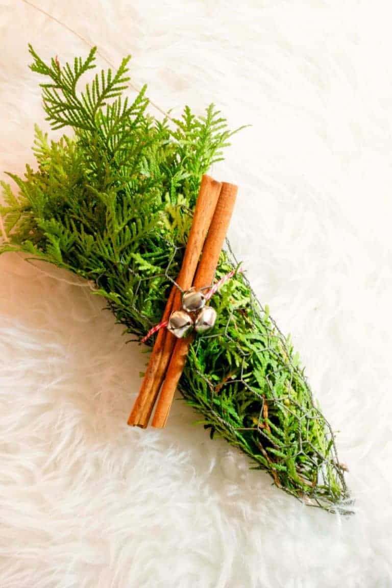 Rustic Evergreen Christmas Decor - Chicken Wire Evergreens with Cinnamon Sticks, jingle bells and twine.