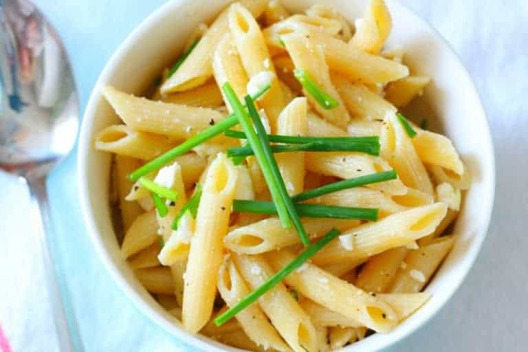 Penne Pasta in Bowl with Feta Cheese, Olive Oil, and Fresh Chives