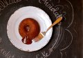 Chocolate Lava Cake on Blue plate with antique fork on a chalkboard background