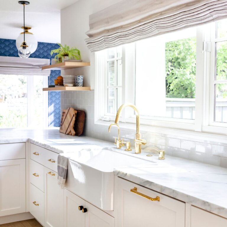 wall of windows above sink and countertop in a remodeled kitchen