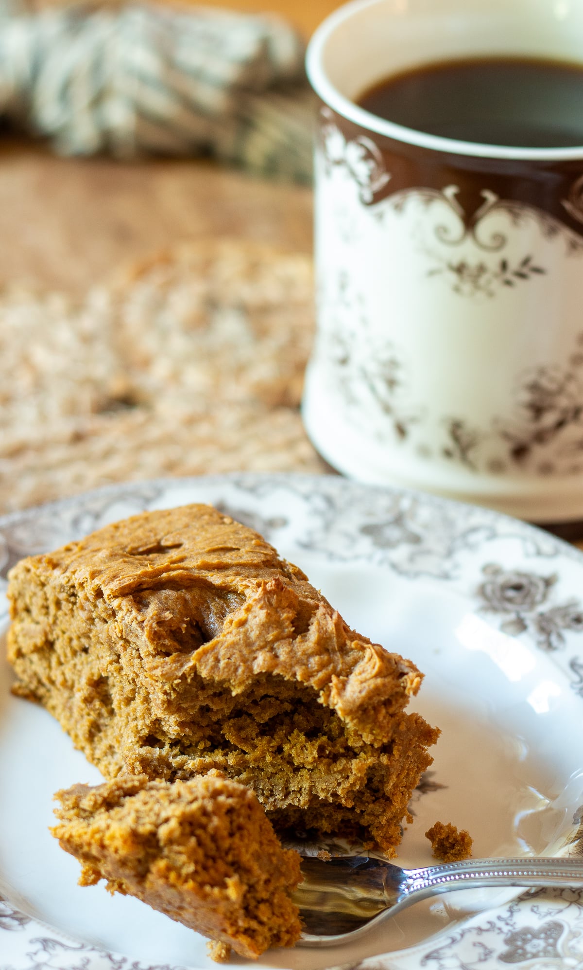 slice of 2 ingredient pumpkin cake with a cup of coffee