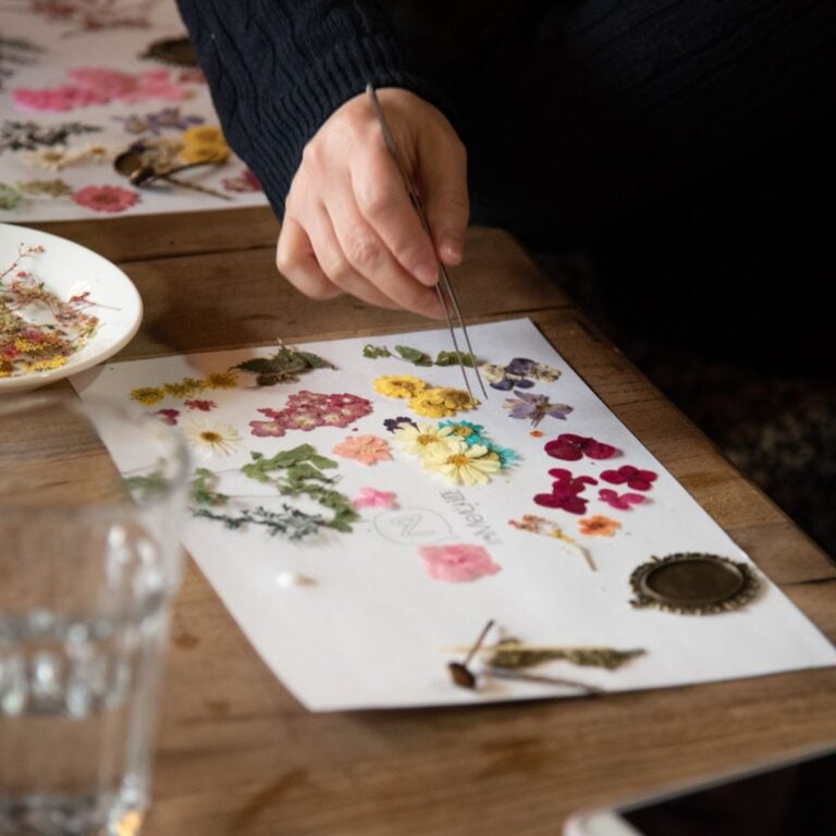 Crafting eco-friendly home decor with pressed flowers for sustainable celebrations.