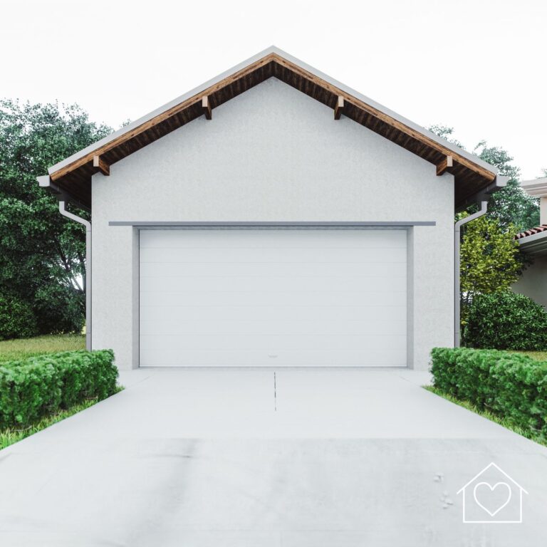 A simple, sleek white garage with a single garage door, bordered by greenery. The eaves have a natural wood finish, adding warmth and contrast to the clean white exterior.