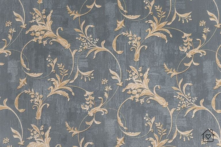A close-up of a luxurious grey wallpaper with golden floral and vine-like patterns. The intricate design and subtle metallic accents create an elegant and timeless look, perfect for classic or modern interiors.