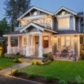 Beautiful, well-lit craftsman-style home with manicured lawn and durable weather-resistant exterior materials.