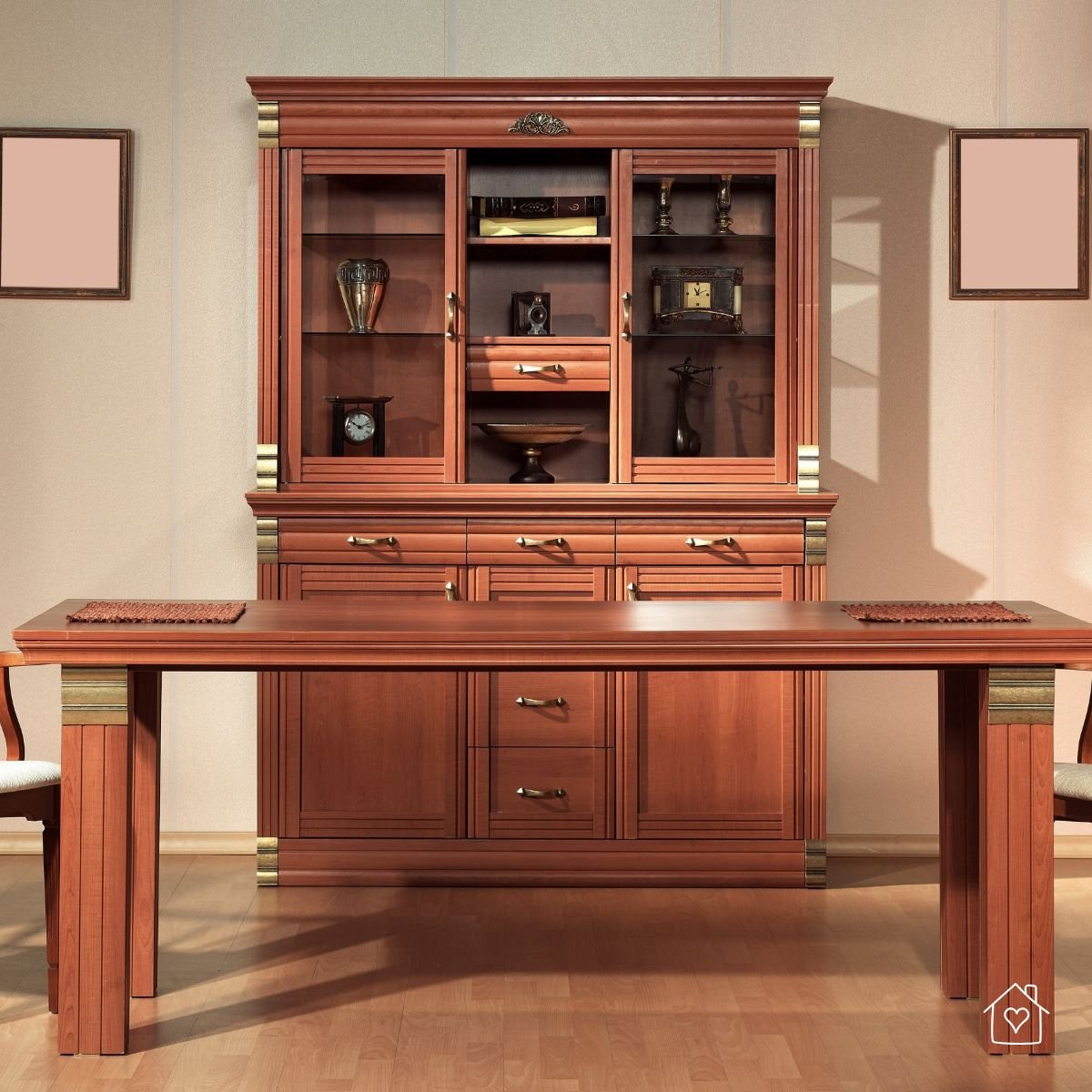 Traditional wooden dining room cabinet with glass doors and a matching table, perfect for adding sophistication while using durable, timeless furniture.