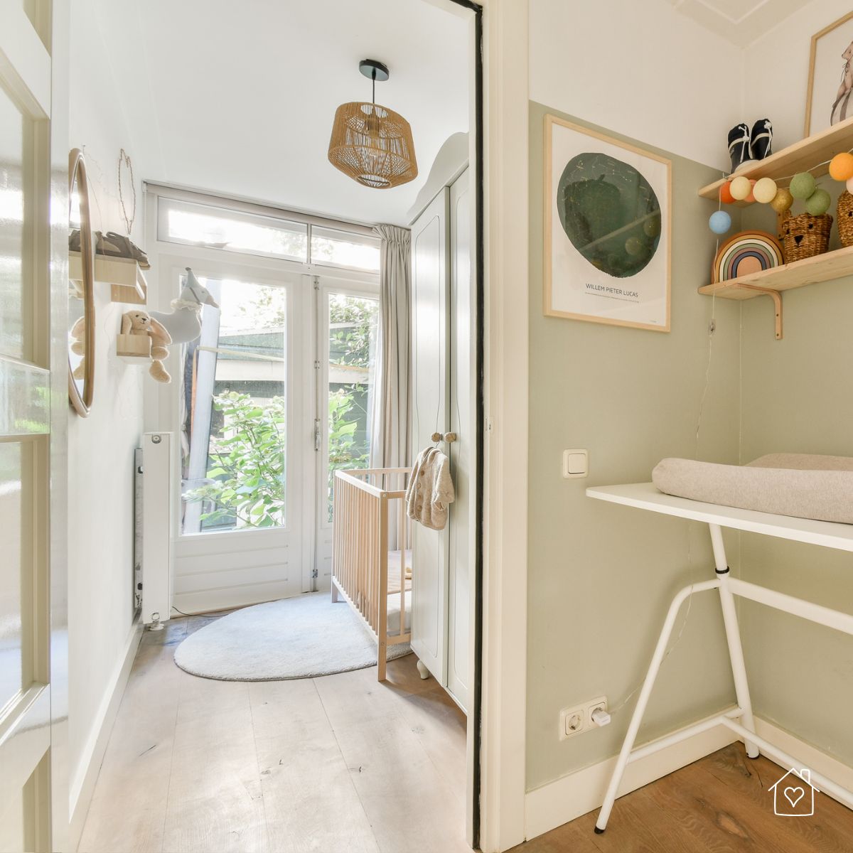 A light-filled nursery space with a crib, changing station, and playful decor, perfect for creating a functional and stylish baby area in any home.