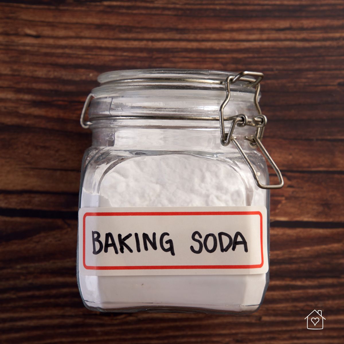 A labeled glass jar filled with baking soda, perfect for DIY carpet cleaning solutions.