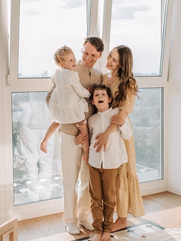 Warm family moment captured by a bright window, symbolizing love and togetherness.