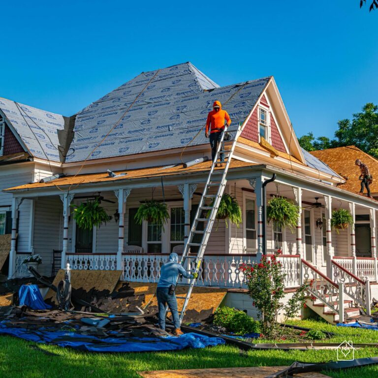 Roofing crew removing old shingles and installing new underlayment on a Murfreesboro home.
