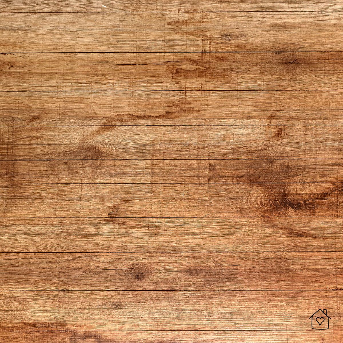 Detailed view of light scratches and wear marks on hardwood floor planks.