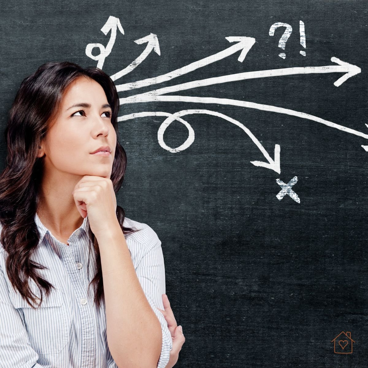 Woman thinking as arrows branch in many directions on a chalkboard.