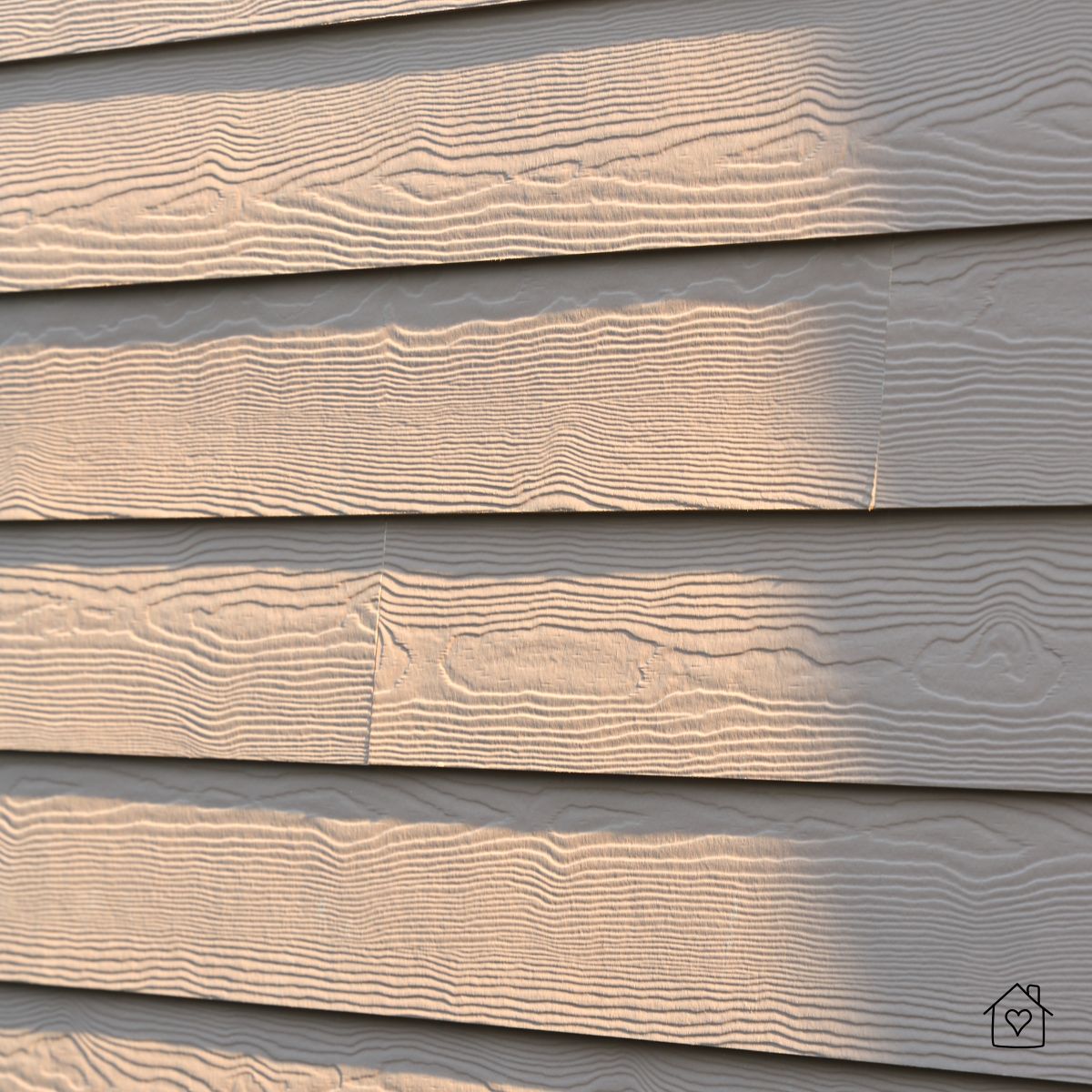 Close-up of fiber cement lap siding with wood-grain texture and tight seams