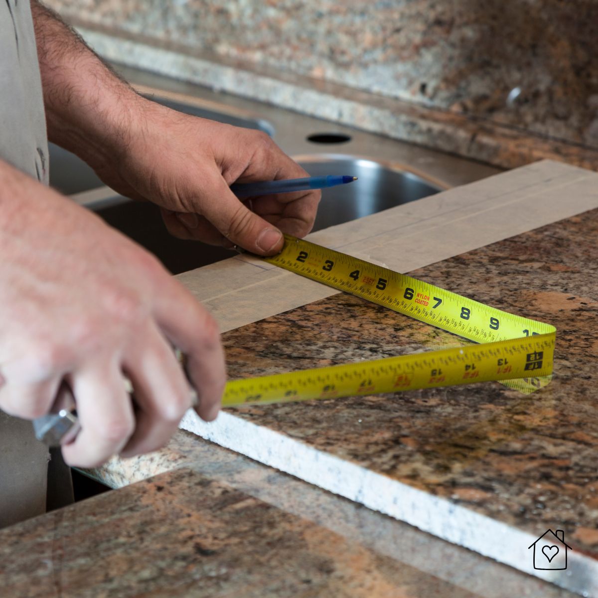 Professional measuring granite countertop with a tape measure before installation, showcasing craftsmanship and precision in modern kitchen design.
