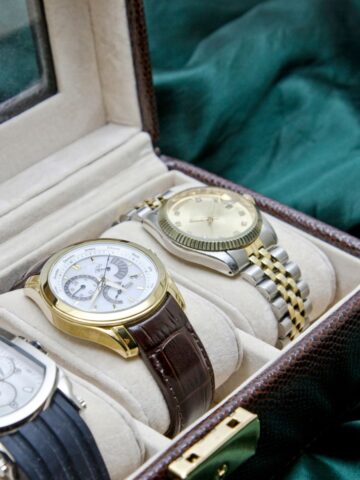 Luxury mechanical watches in a leather display case—fine timepieces worth investing in and preserving.