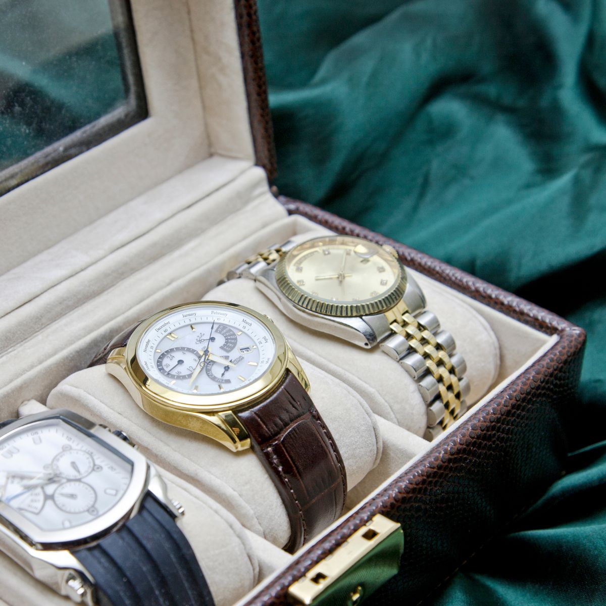 Luxury mechanical watches in a leather display case—fine timepieces worth investing in and preserving.