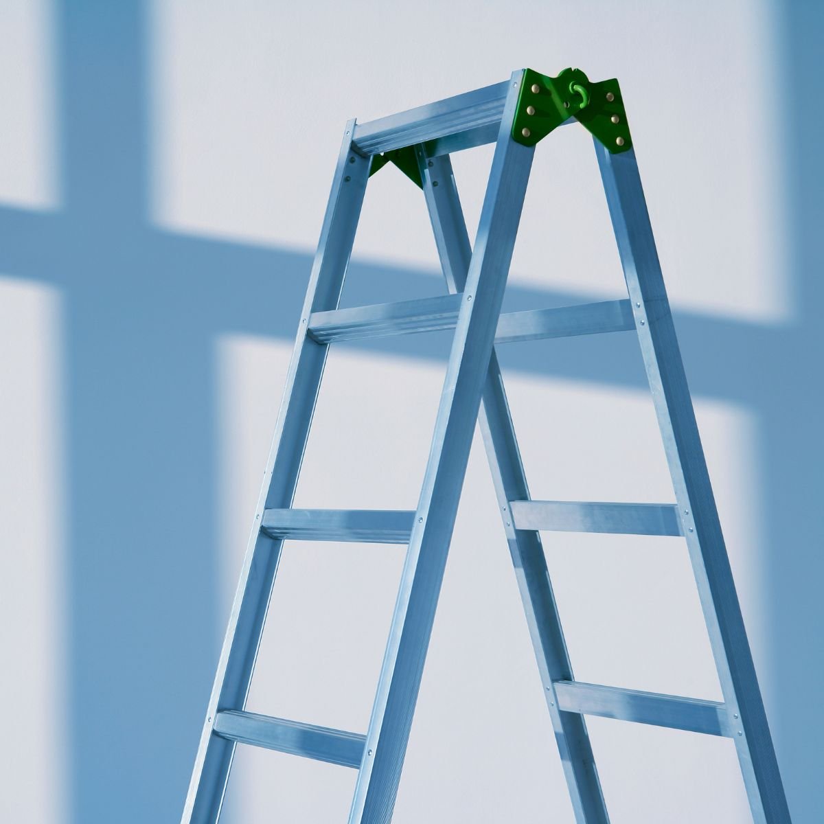 A-frame step ladder fully opened with hinges and spreaders locked, ready for safe indoor use.
