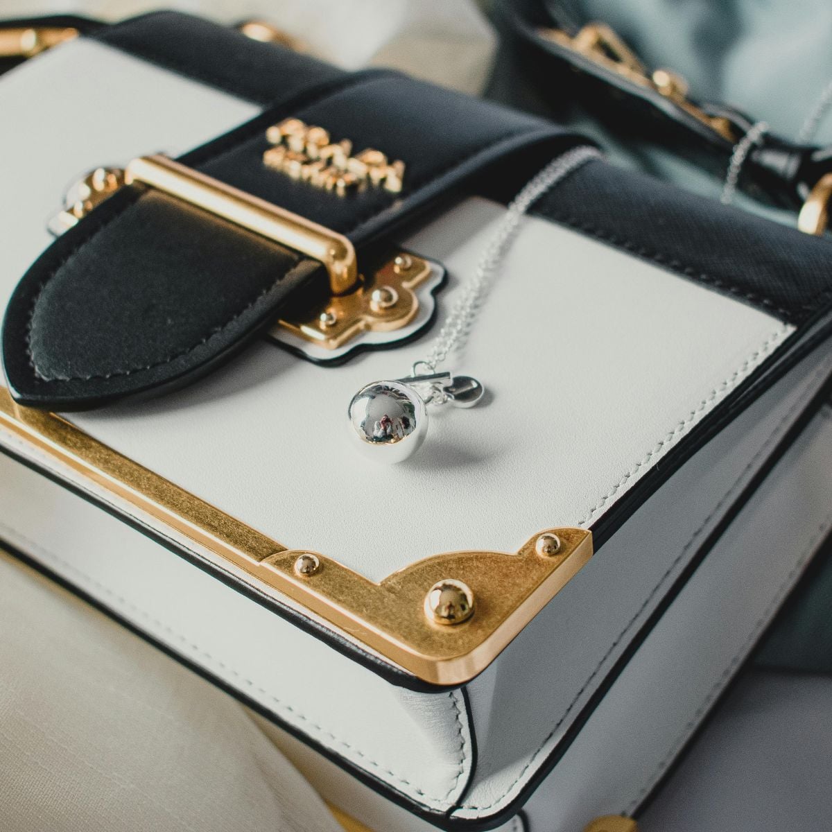 Close-up of luxury handbag with gold accents—craftsmanship and resale value in focus.