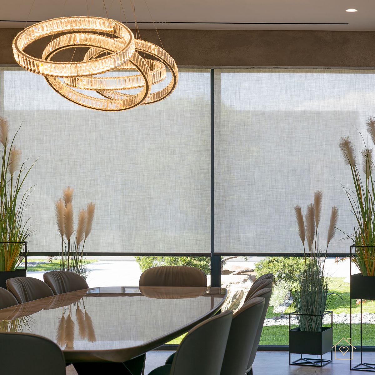Large motorized roller shades softly filtering light in a contemporary dining room