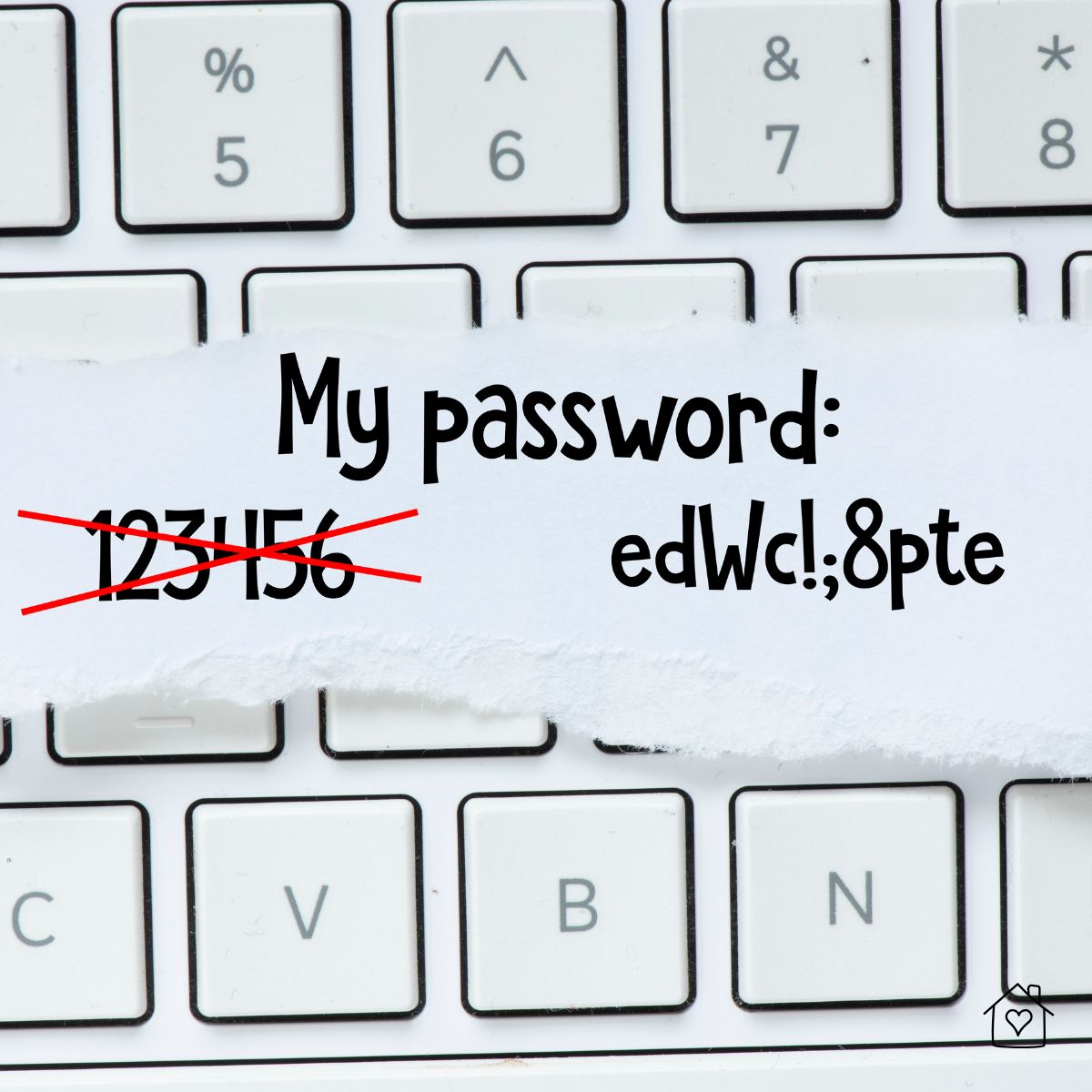 Paper note on a computer keyboard showing a weak password crossed out and a strong password example written underneath.