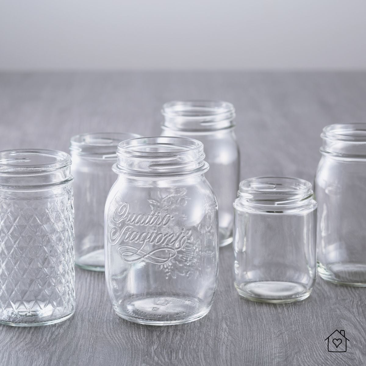 Collection of empty glass jars in different sizes, showing common containers used in everyday kitchens