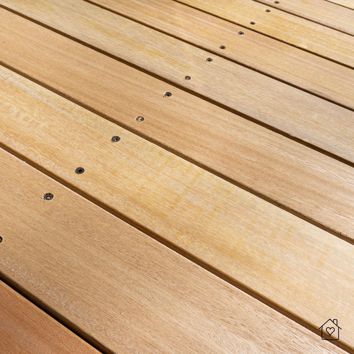 freshly refinished wooden deck boards with clean surface and visible fasteners