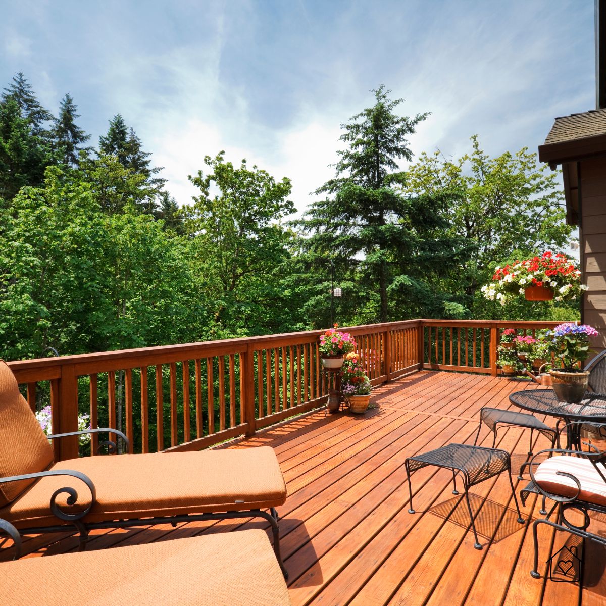 large wooden deck with lounge chairs and forest view in natural daylight