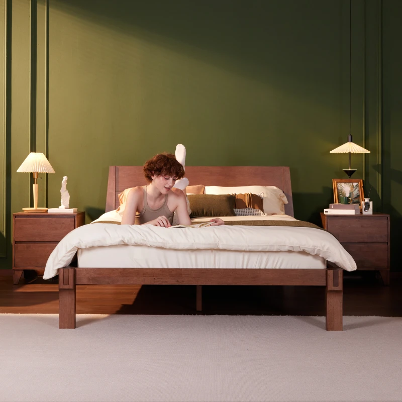 Solid wood Japanese-style bed frame with a low, sturdy profile and simple headboard in a minimalist bedroom setting