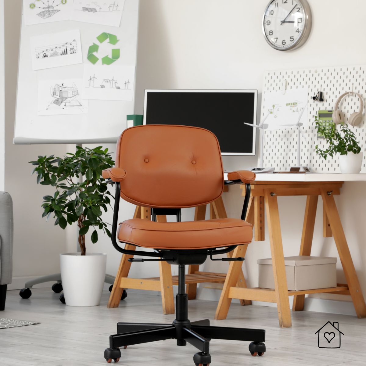 Tan upholstered office chair in a modern workspace&mdash;an example of a high quality refurbished office chair with cushioned seat, armrests, and adjustable base.