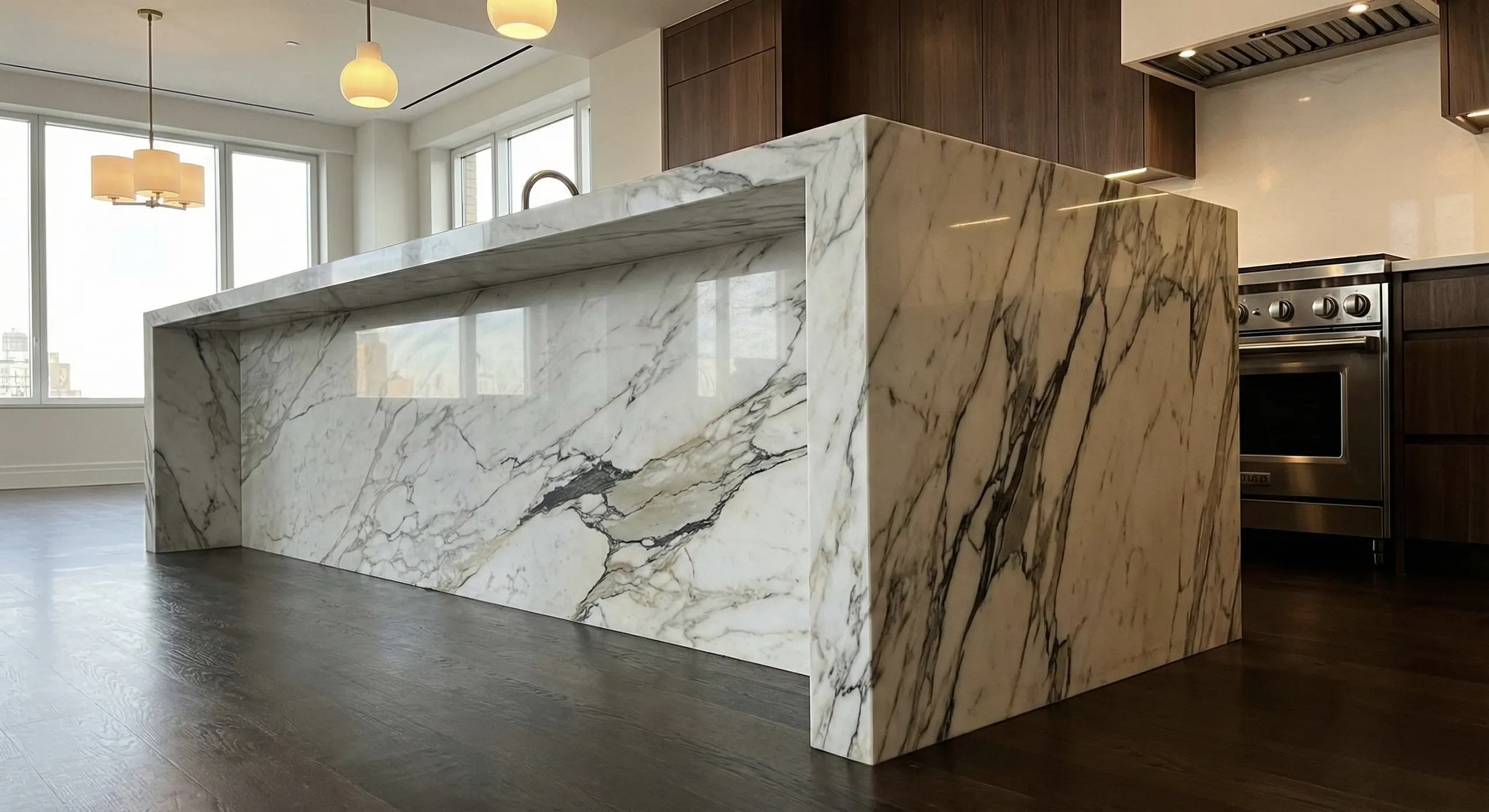 Marble Waterfall Kitchen Island in Luxury Manhattan Renovation Luxury Manhattan kitchen with marble waterfall island, bold natural veining, and seamless countertop edges.