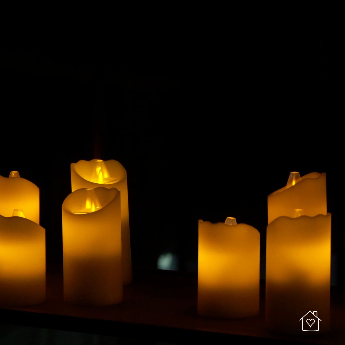 Battery-powered candles used as safer lighting during a power outage instead of open-flame candles
