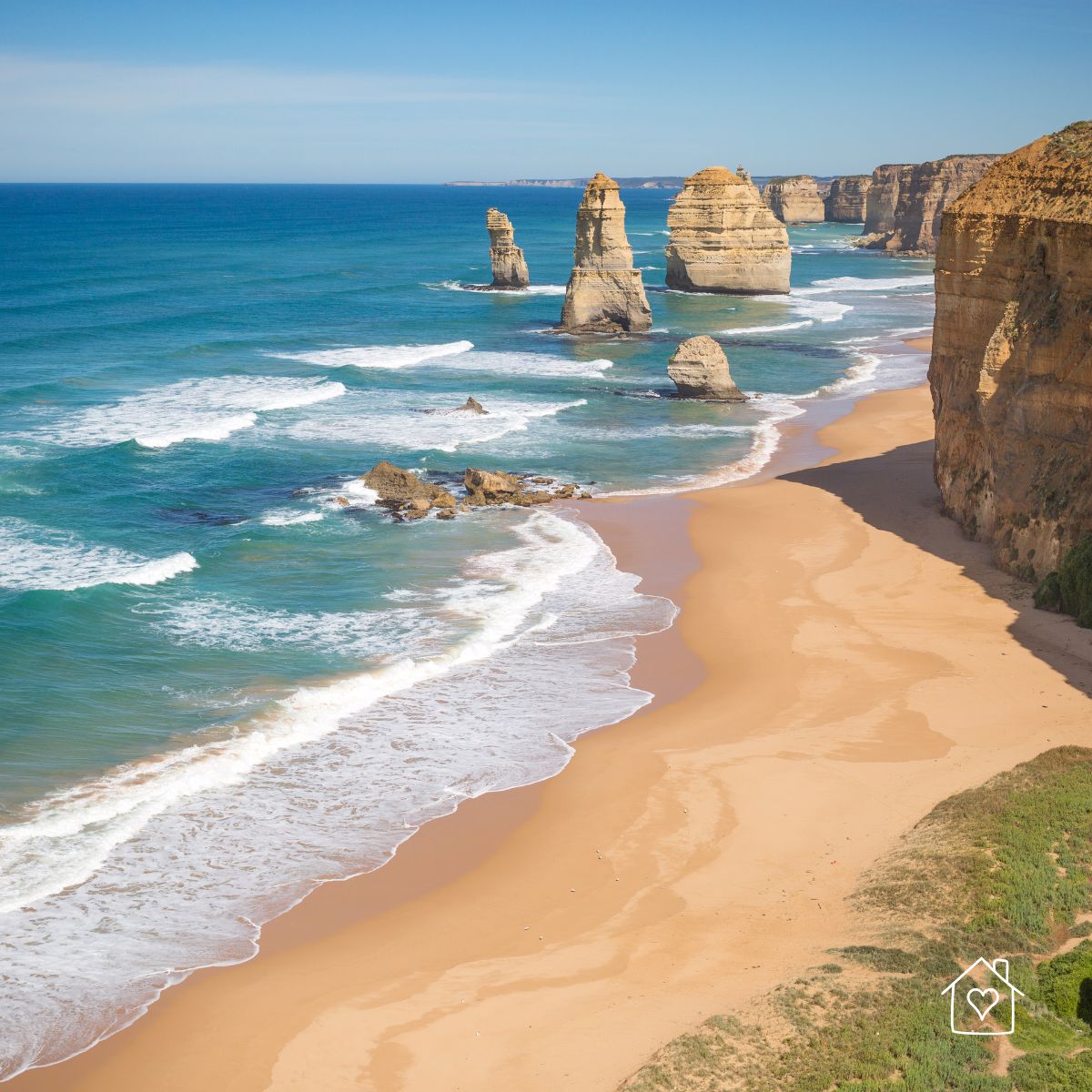 Coastal view of the Twelve Apostles rock formations along the beach and ocean in Australia