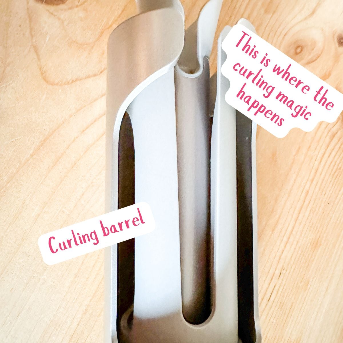 Close-up of the TYMO CurlPro ceramic curling barrel and hair slot showing where hair is inserted for automatic curling