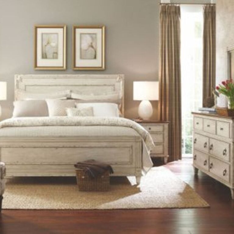 Light wood bedroom furniture set with upholstered bed, matching nightstands, dresser, and neutral decor