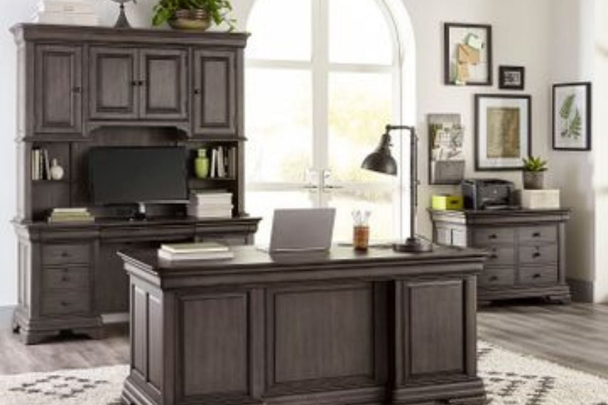 Dark wood home office furniture set with executive desk, hutch, storage cabinets, and bright arched window