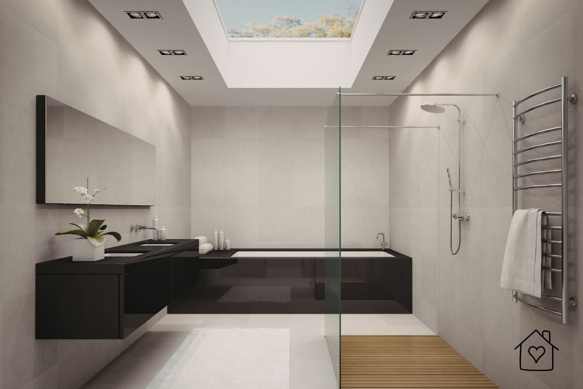 Contemporary bathroom with large ceiling skylight bringing daylight into a windowless space