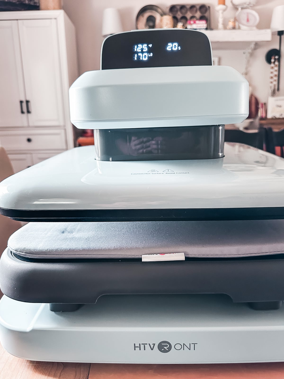 HTVRont Auto Heat Press 2 stacked on lower platen with digital display showing temperature and time settings