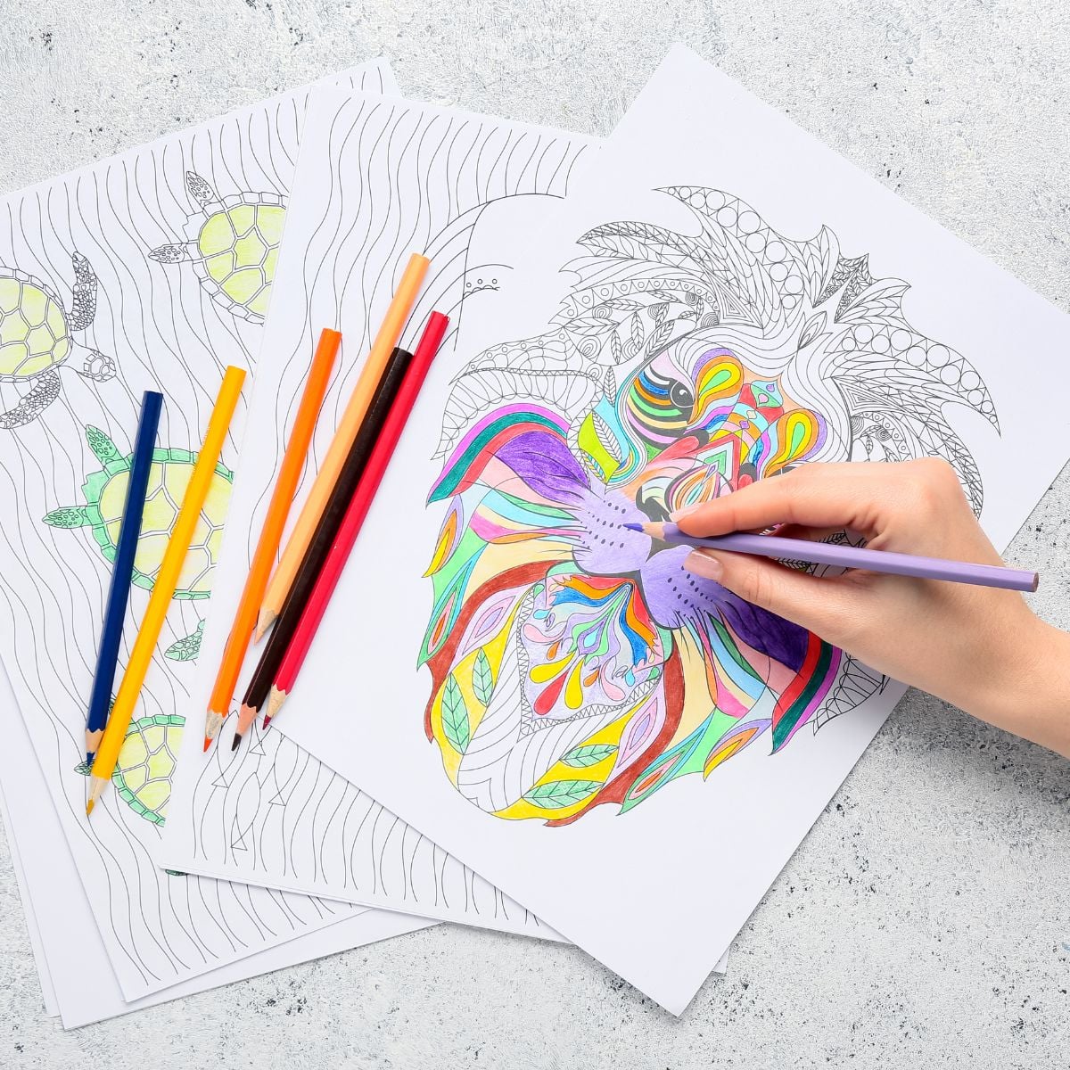 Colored PencilsPrintable coloring pages with colored pencils and a partially colored floral design on a tabletop