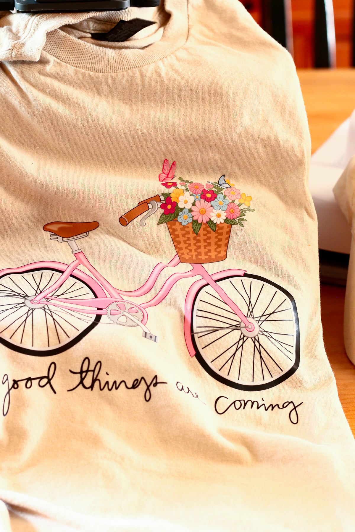 DTF bicycle design pressed onto a t-shirt with the HTVRont A100