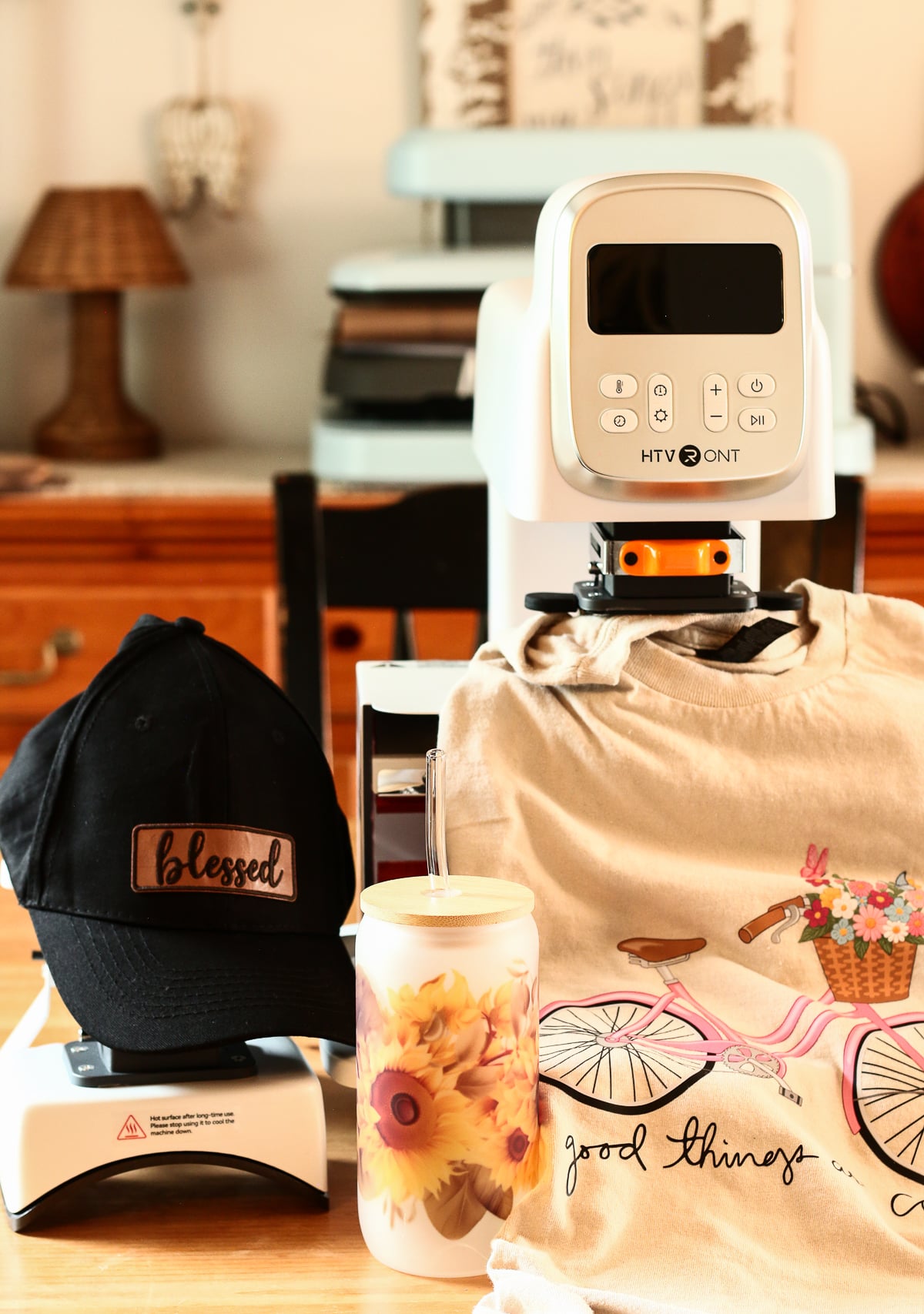 Finished hat, tumbler and shirt projects made with the HTVRont A100