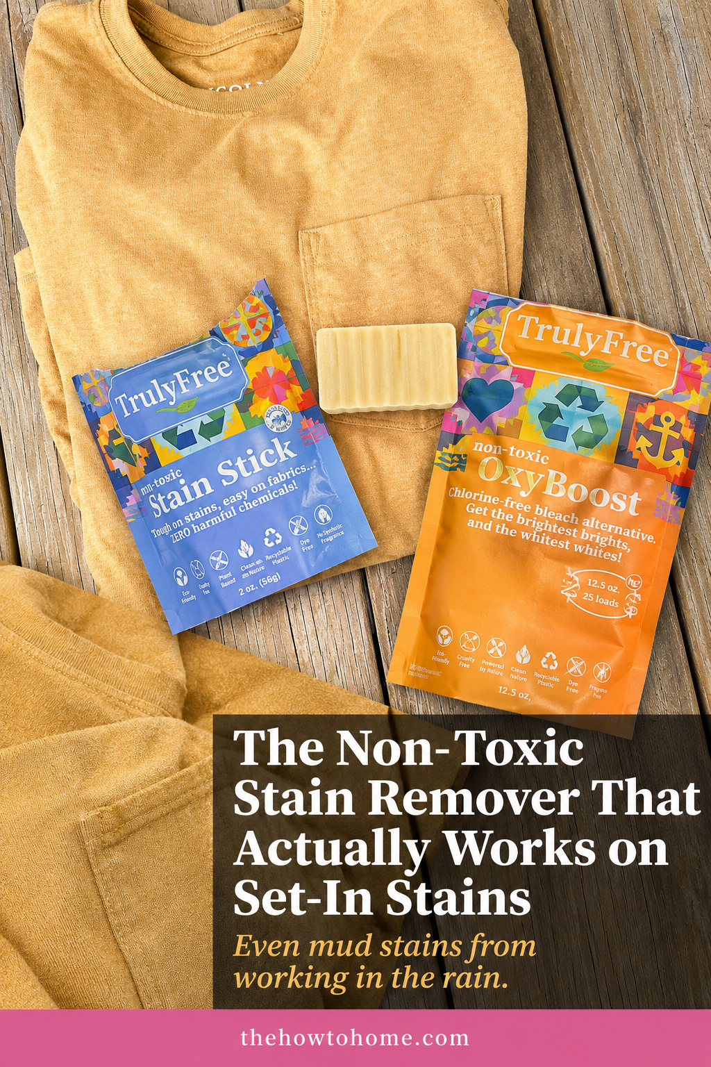 Truly Free non-toxic stain stick and OxyBoost laundry products displayed on clean folded mustard yellow shirt on wood surface