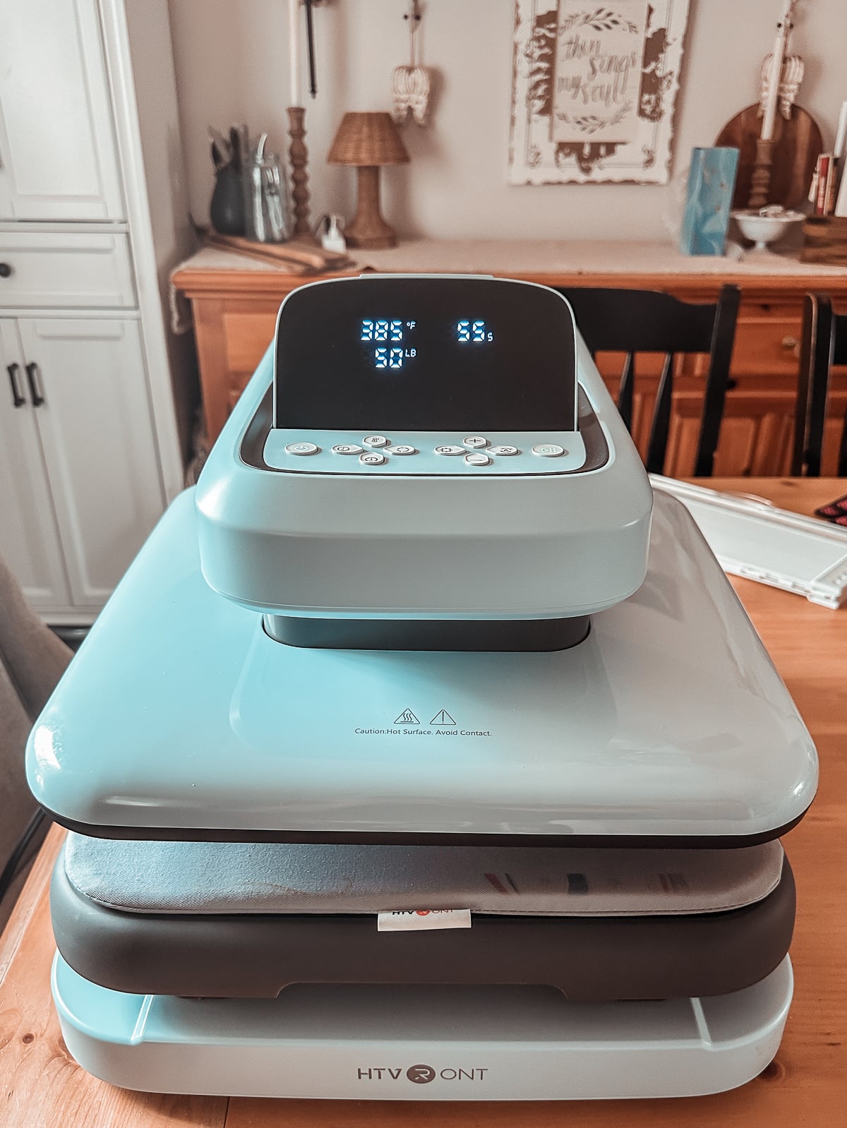 HTVRont Auto Heat Press 2 set to 385 degrees on a farmhouse table, ready to press a sublimation scarf