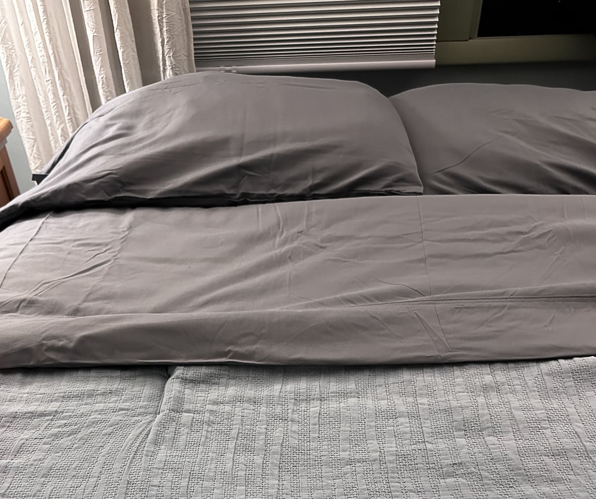 Gray Silvery Comfort Sheets made up on the bed with matching pillowcases