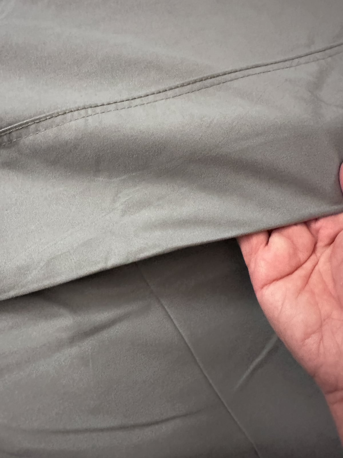 Hand smoothing the soft silver infused Silvery sheet to show the texture