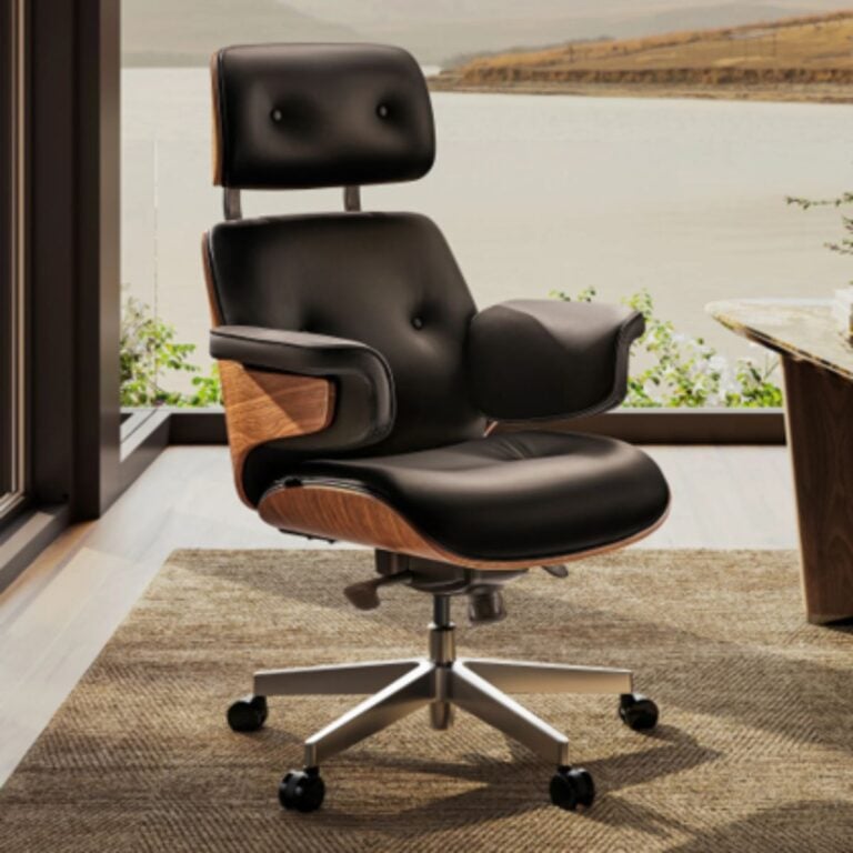 Black leather Mathias home office chair with a curved walnut shell and aluminum base, sitting beside a window with a lake view