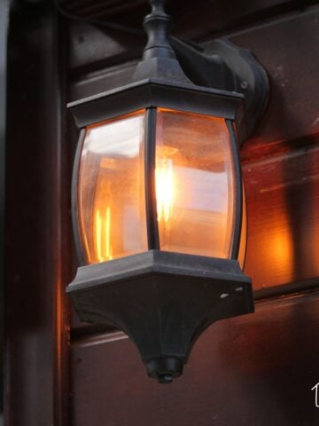 Outdoor light - black fixture with a yellowish light at dusk
